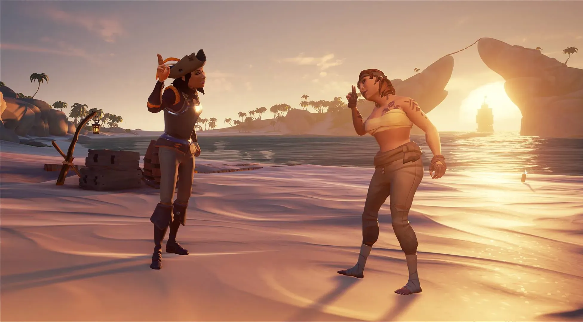 Two pirates do the 'Make Friends' emote on the beach of Smuggler's Bay while a galleon travels through the archway in the background.